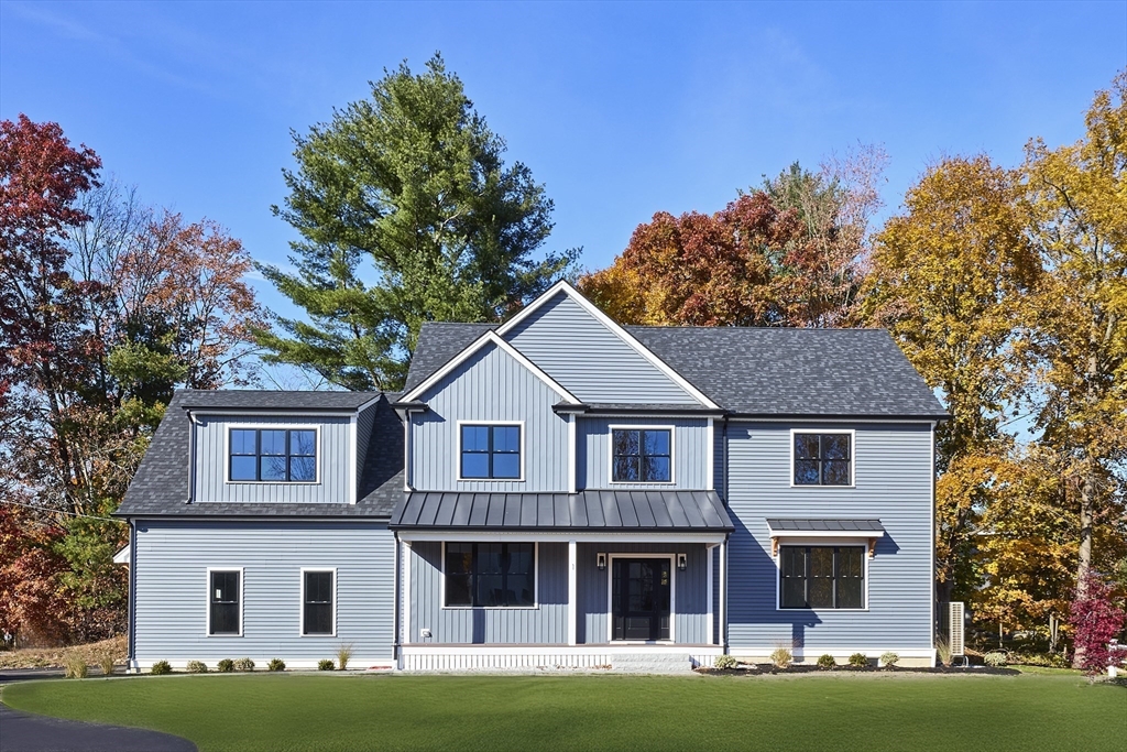 1 Thomas Drive Acton, MA 01720 - Photo 4 of 36 a front view of a house with a garden