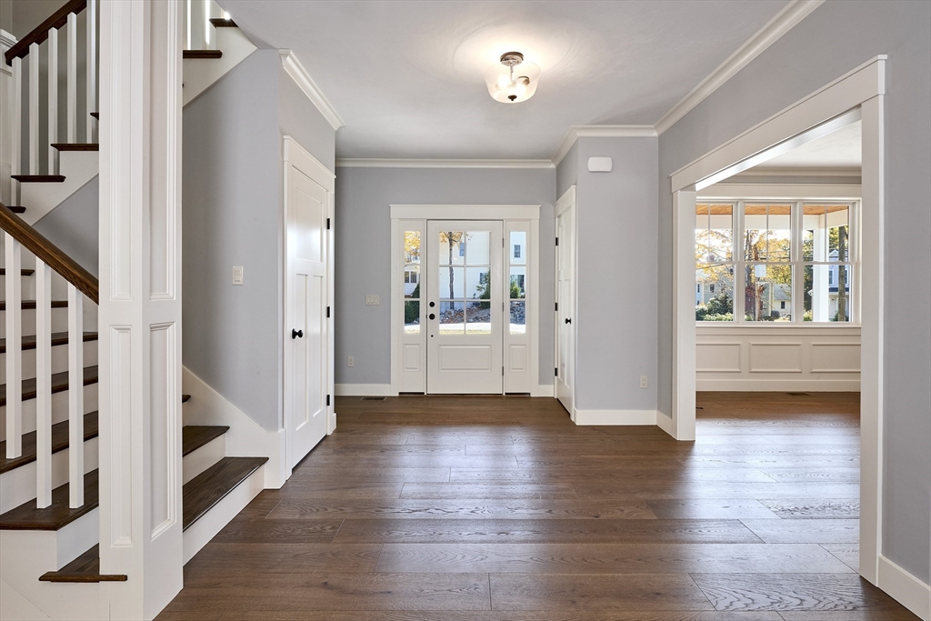 1 Thomas Drive Acton, MA 01720 - Photo 7 of 36 a view of a hallway view with wooden floor and staircase