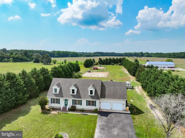 a aerial view of a house with a big yard