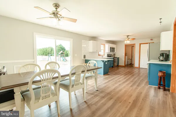 a view of a dining room with furniture window and outside view