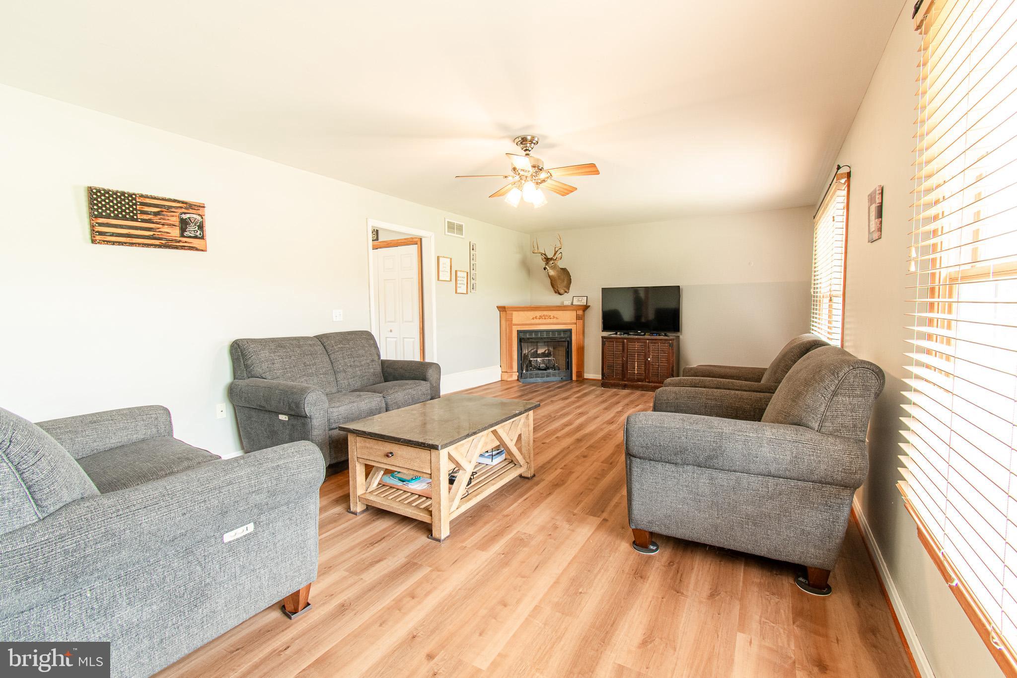 22408 Hog Creek Road Preston, MD 21655 - Photo 6 of 45 Large living room with a gas fireplace
