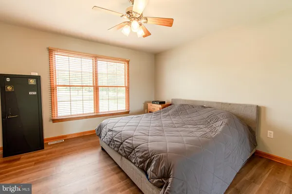 a bedroom with bed and window