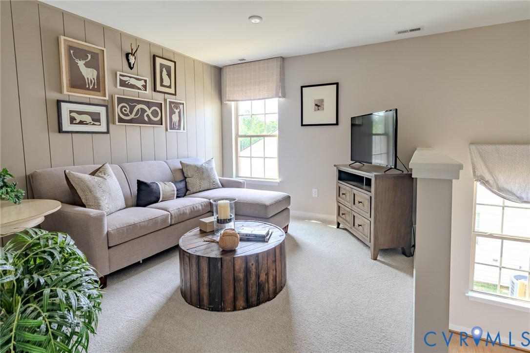5525 Riggs Drive, Unit 334 Moseley, VA 23120 - Photo 19 of 24 a living room with furniture and large window
