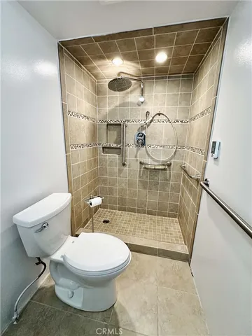 a bathroom with a toilet and shower