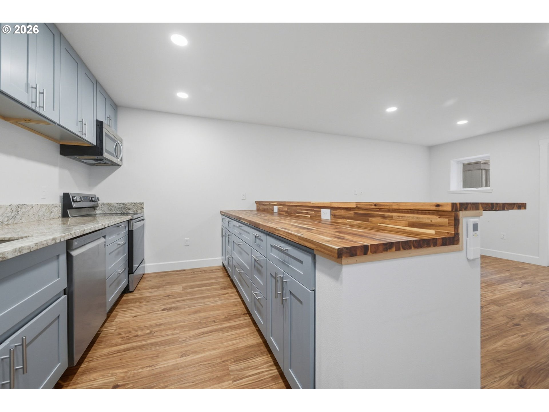 50 South 17th Street Cottage Grove, OR 97424 - Photo 11 of 24 a kitchen with stainless steel appliances granite countertop a sink and a stove