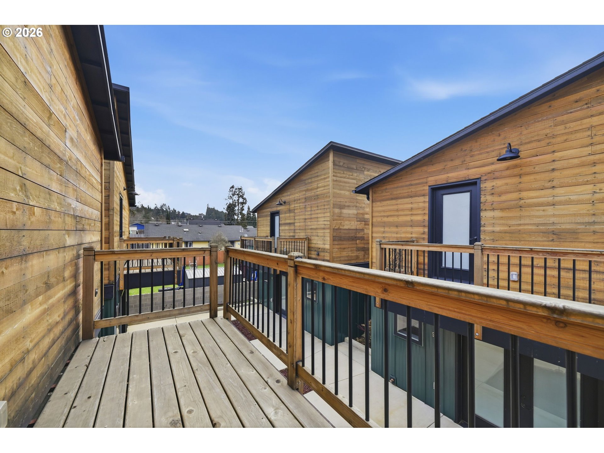 50 South 17th Street Cottage Grove, OR 97424 - Photo 18 of 24 a view of a balcony with wooden floor and fence