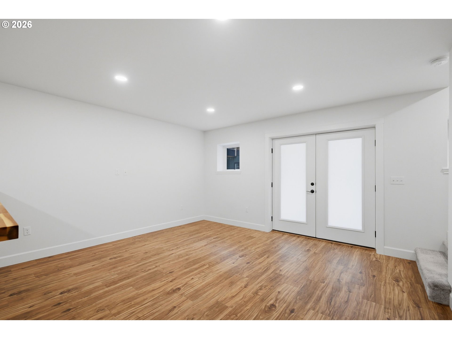 50 South 17th Street Cottage Grove, OR 97424 - Photo 7 of 24 a view of an empty room with wooden floor