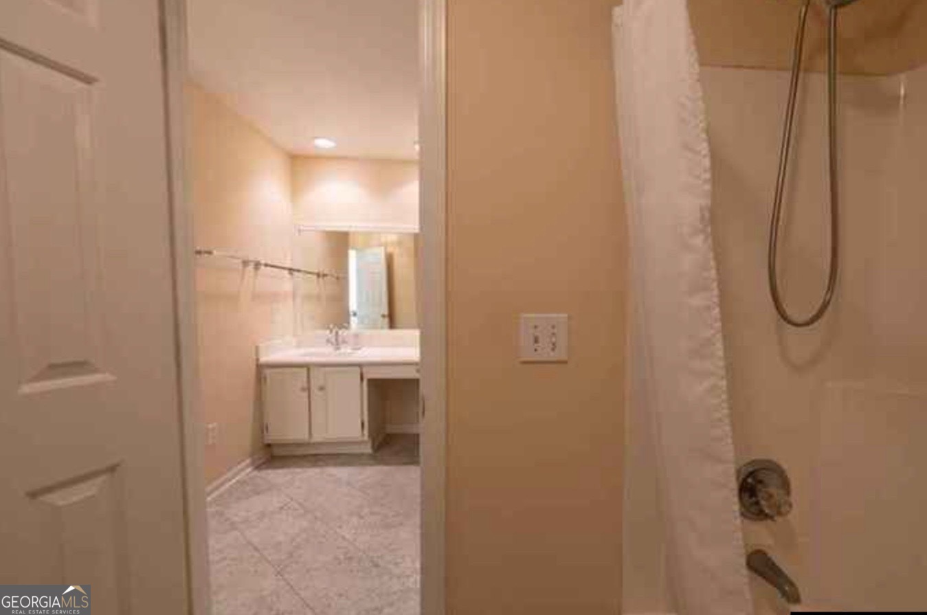 212 Abingdon Way Northeast Sandy Springs, GA 30328 - Photo 13 of 21 a bathroom with a sink and mirror