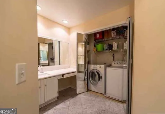 a view of a tennis ground with large trees