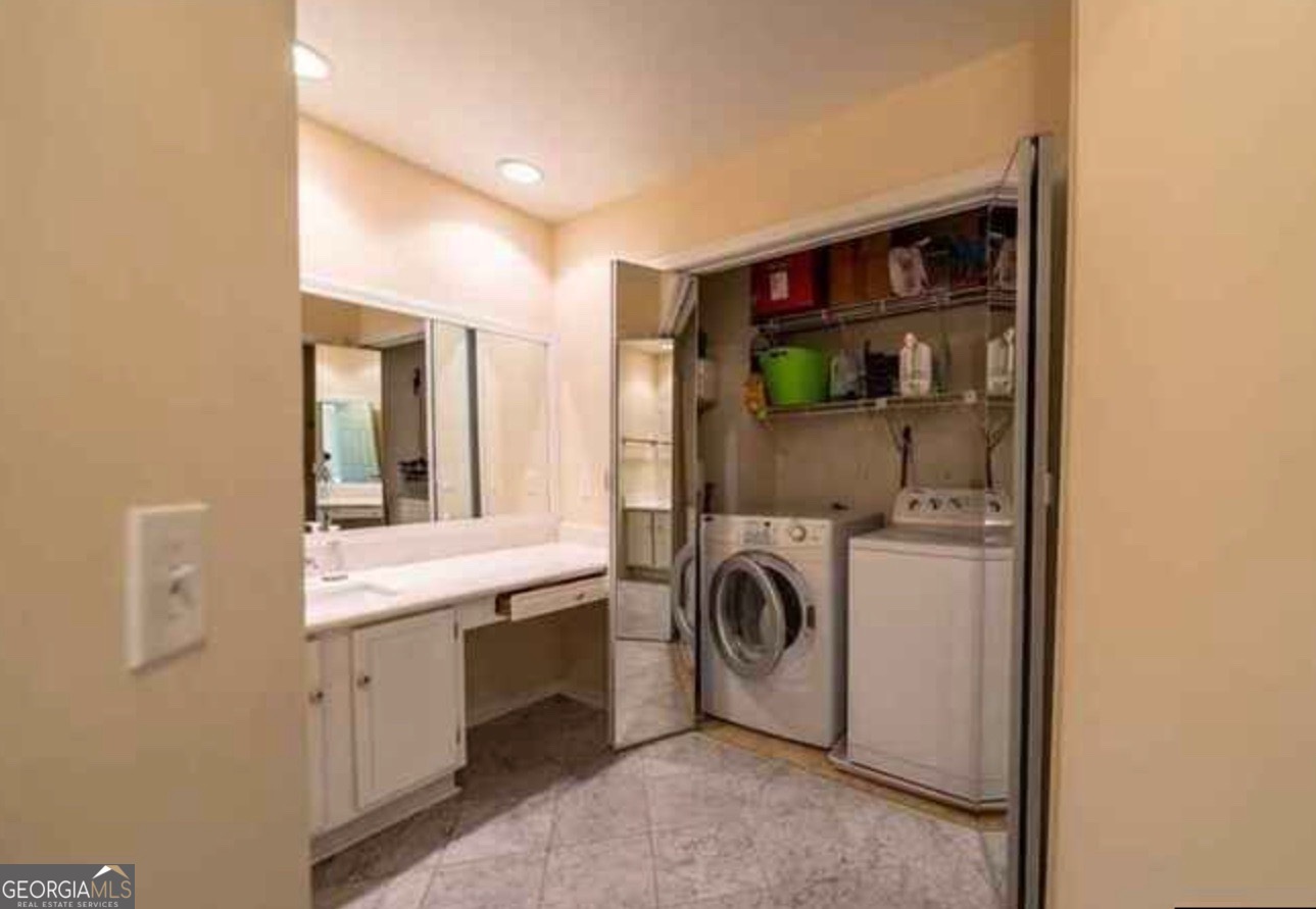212 Abingdon Way Northeast Sandy Springs, GA 30328 - Photo 16 of 21 a utility room with dryer and washer