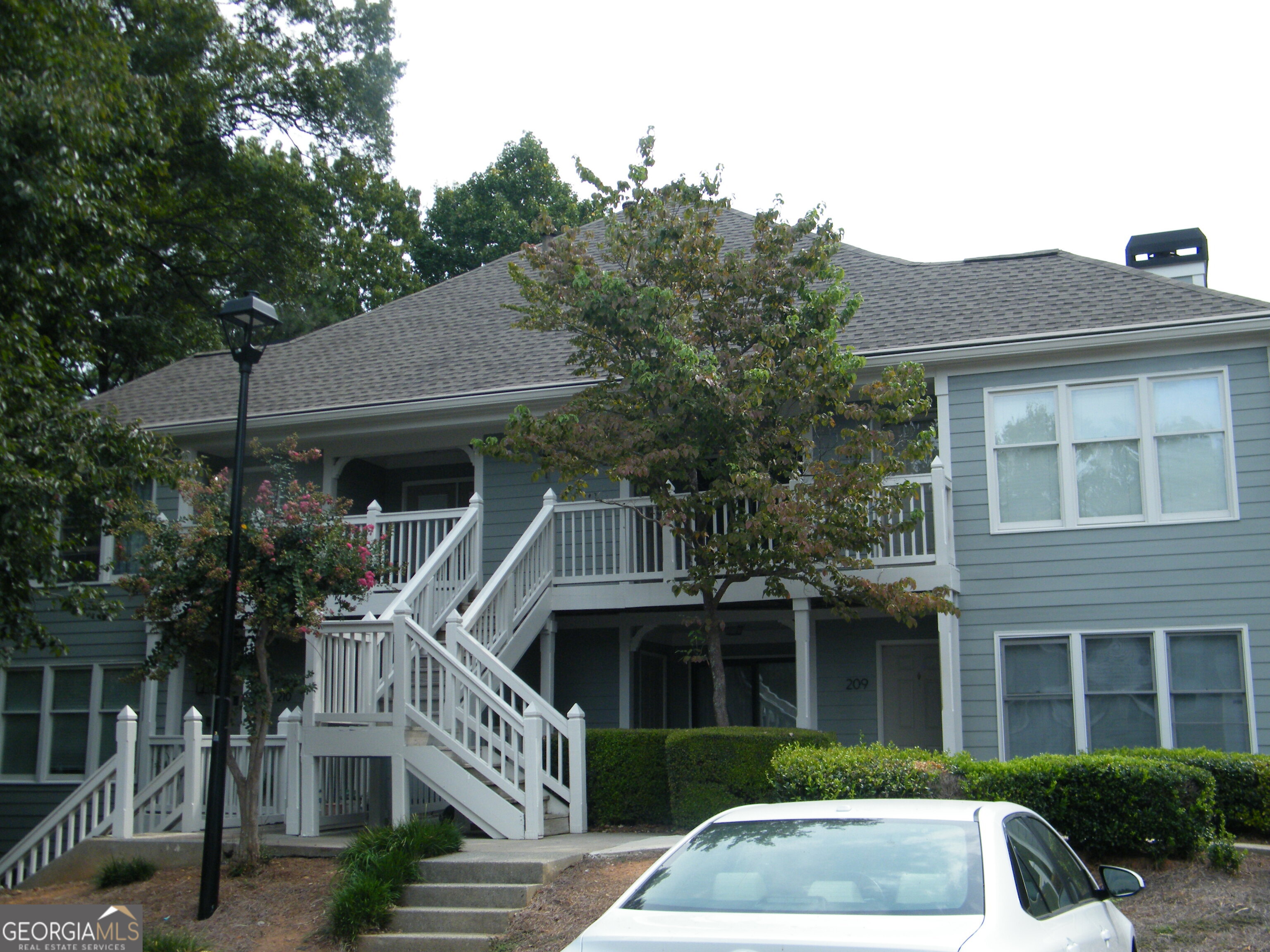 212 Abingdon Way Northeast Sandy Springs, GA 30328 - Photo 2 of 21 a front view of a house with a yard