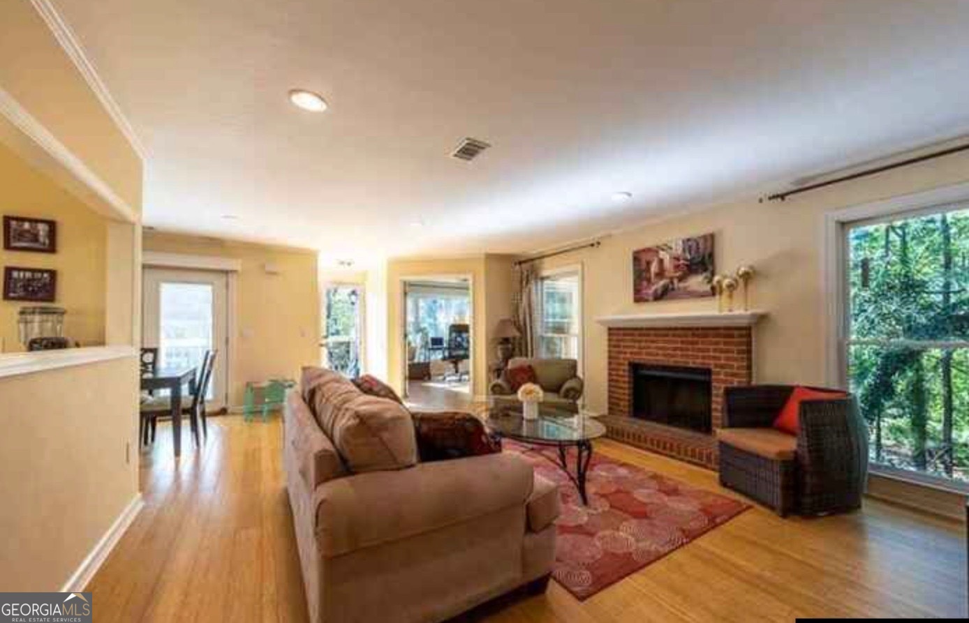 212 Abingdon Way Northeast Sandy Springs, GA 30328 - Photo 7 of 21 a living room with furniture and a fireplace