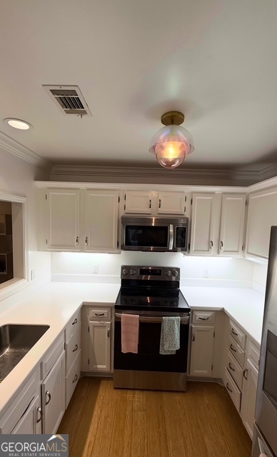 212 Abingdon Way Northeast Sandy Springs, GA 30328 - Photo 9 of 21 a kitchen with a stove and a sink