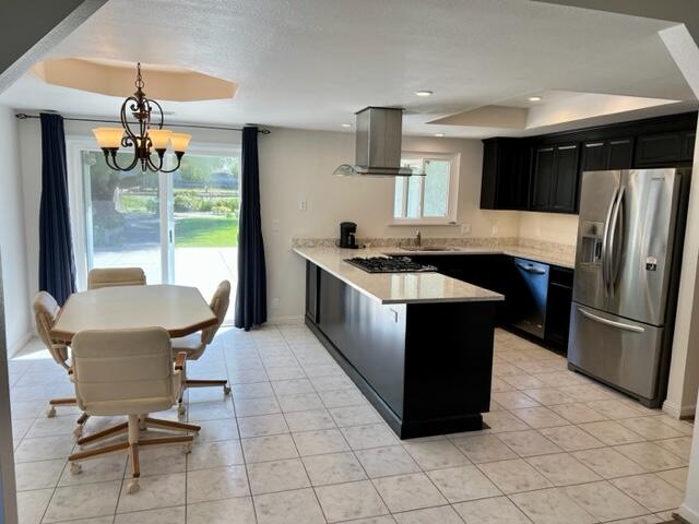 490 Foxen Lane Los Alamos, CA 93440 - Photo 5 of 16 a kitchen with stainless steel appliances granite countertop a refrigerator a sink a stove and a dining table