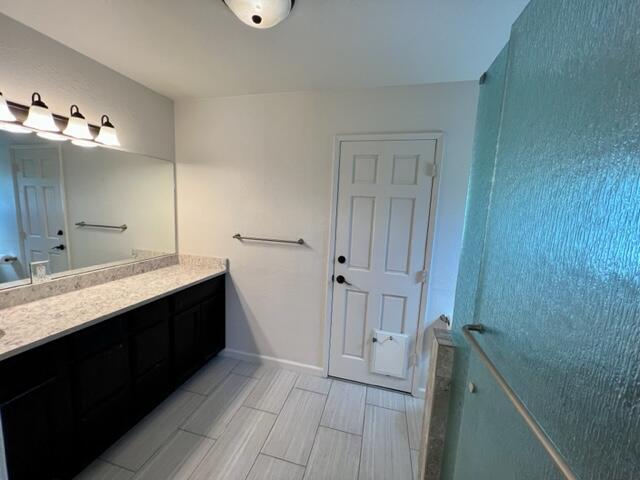 490 Foxen Lane Los Alamos, CA 93440 - Photo 9 of 16 a bathroom with a double vanity sink a mirror and a bathtub