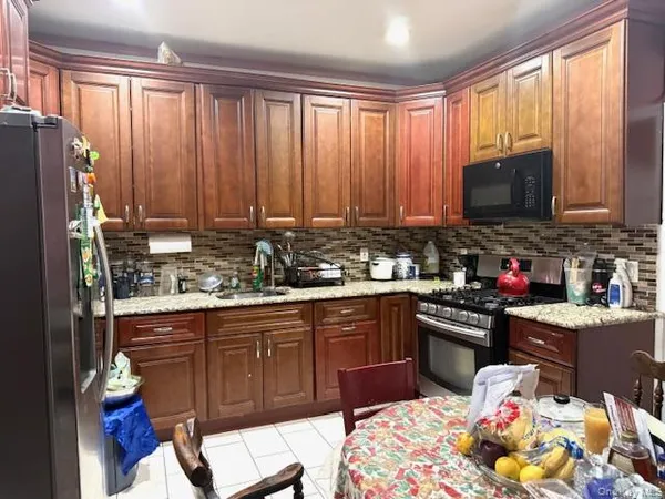 a kitchen with a sink cabinets and appliances