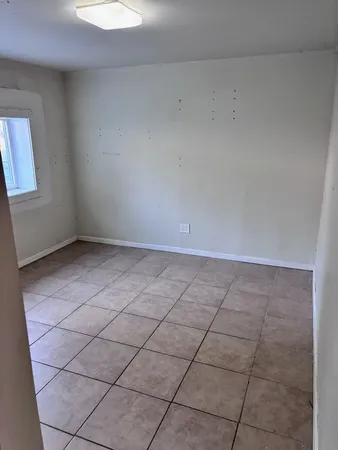 a view of an empty room and window