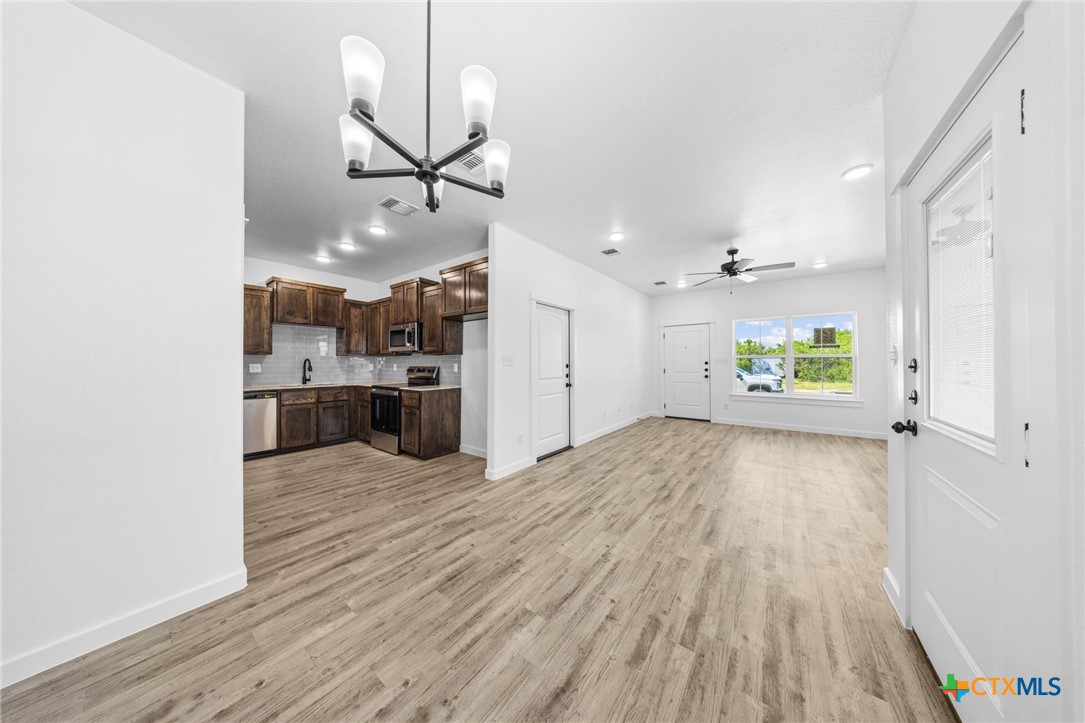 3604 Canvasback Road Killeen, TX 76542 - Photo 13 of 27 a view of a kitchen with a sink and wooden floor