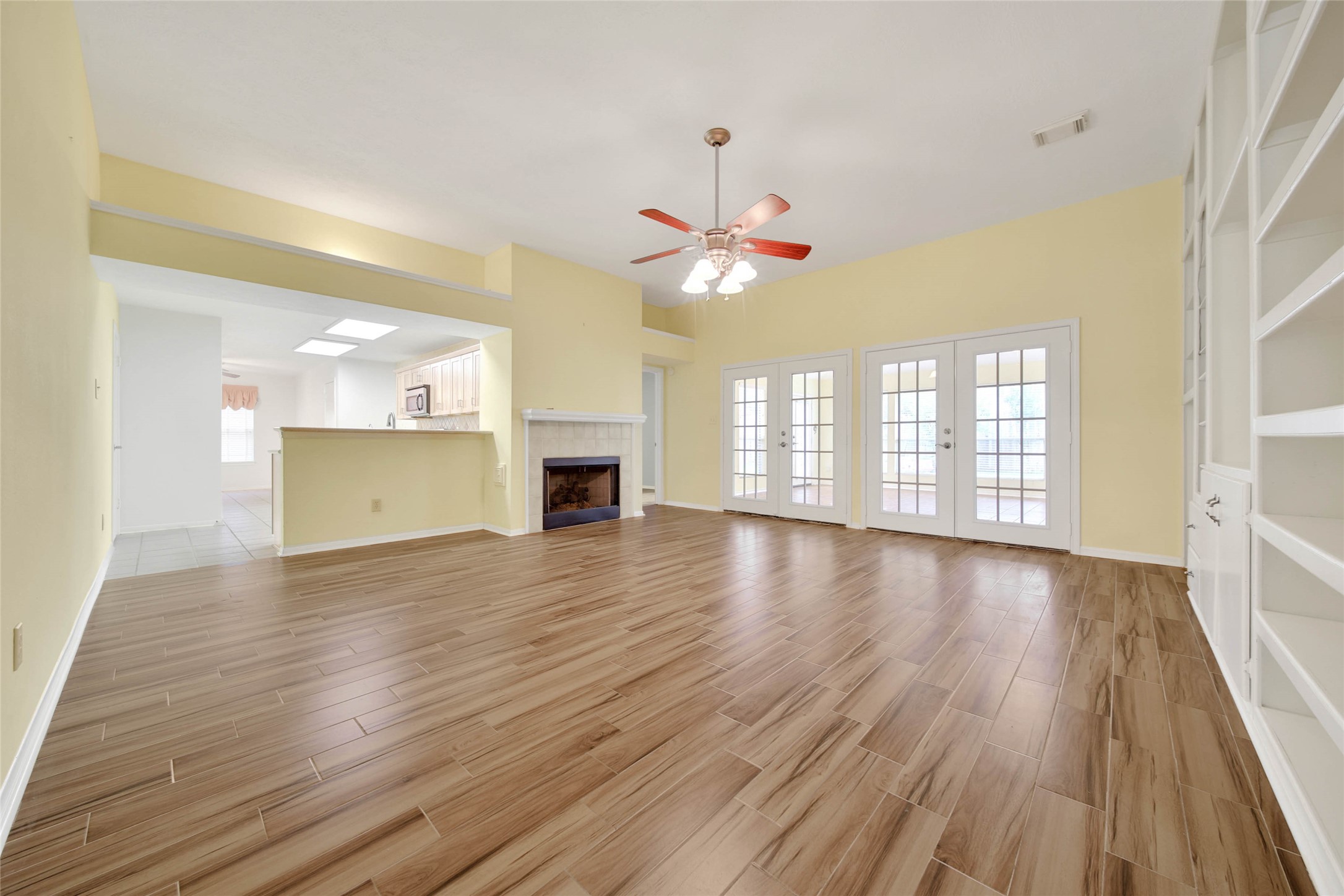 5010 Cupids Bower Court Spring, TX 77388 - Photo 7 of 40 an empty room with wooden floor and windows