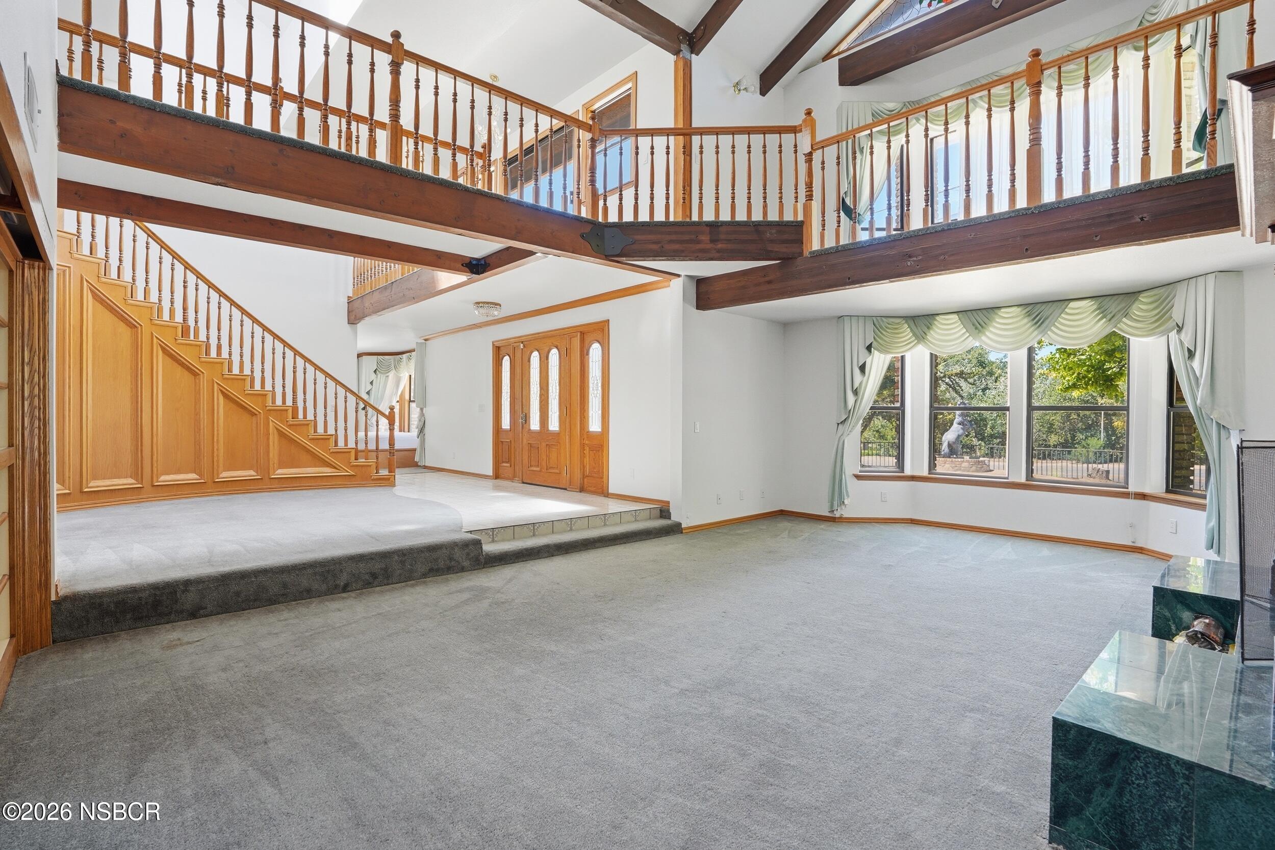 140 East Rice Ranch Road Santa Maria, CA 93455 - Photo 8 of 44 a view of an empty room with wooden floor and windows