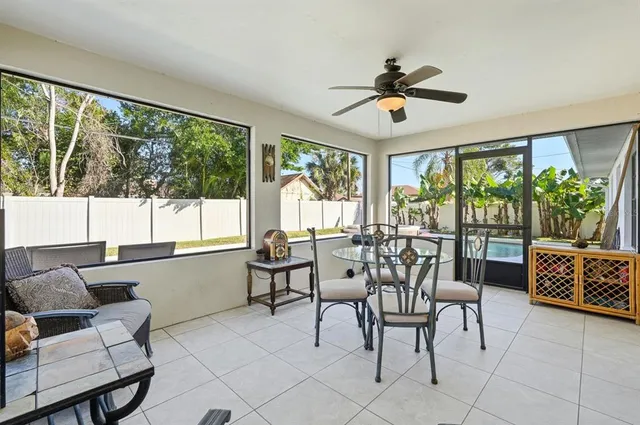 a view of a dining room with furniture window and outside view