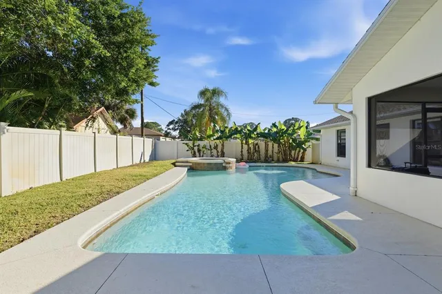 a front view of house with yard and outdoor seating