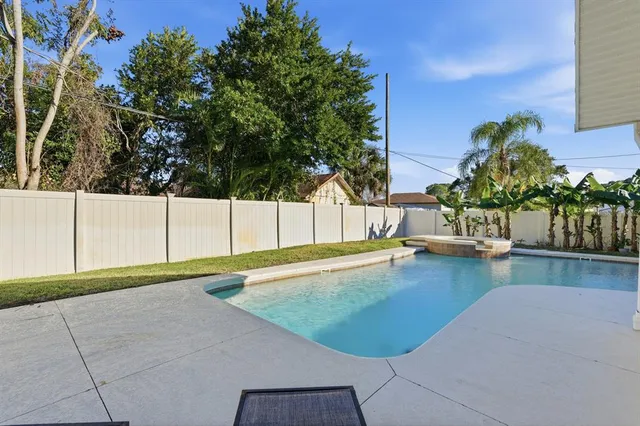 a view of house with a yard