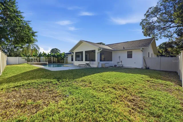 a view of backyard with green space
