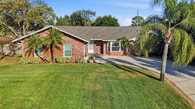 a view of house with back yard