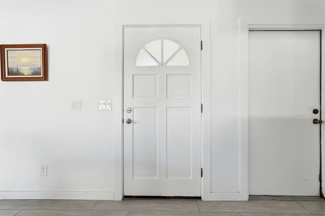 a view of front door with hallway