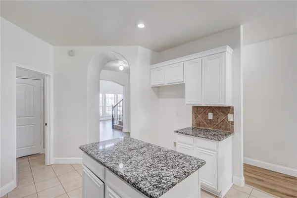 a view of kitchen island with wooden floor