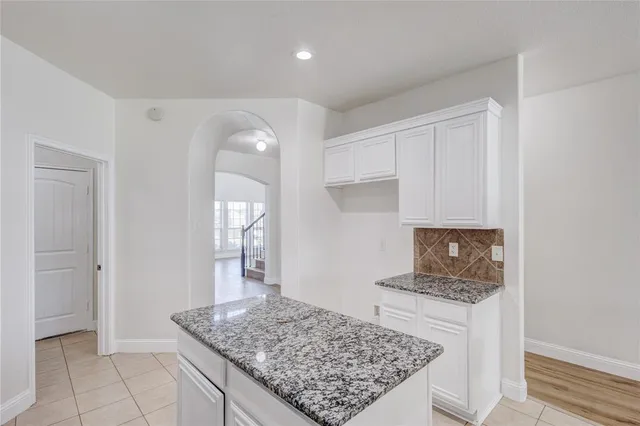 a view of kitchen island with wooden floor