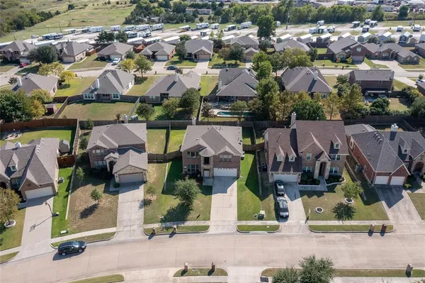 an aerial view of houses with outdoor space