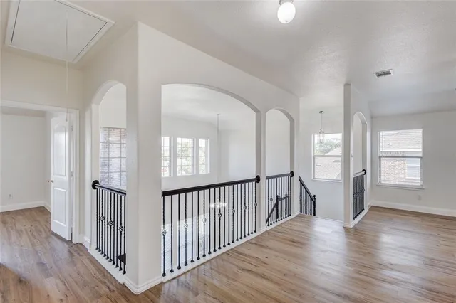 a view of entryway with wooden floor