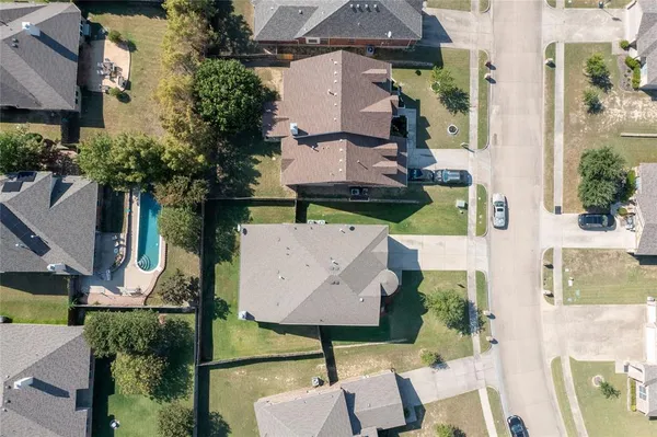 an aerial view of houses with yard