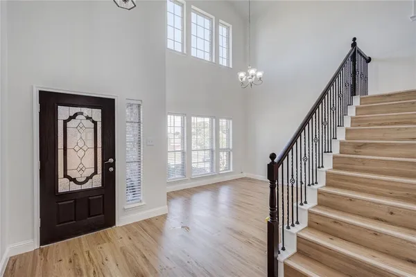 a view of an entryway with wooden floor