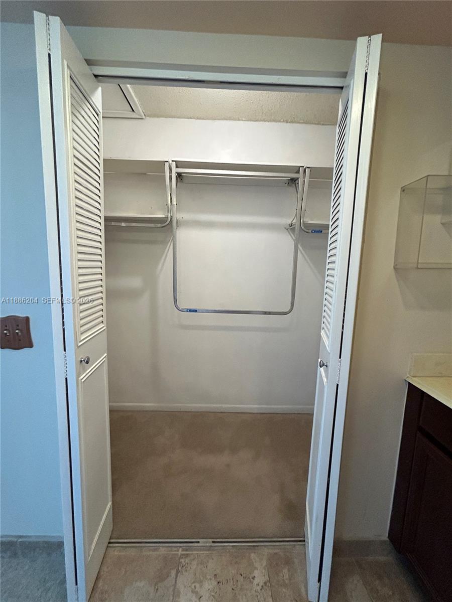 6520 Southwest 20th Street Plantation, FL 33317 - Photo 12 of 43 a bathroom with a glass shower door