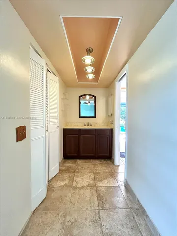 a kitchen with stainless steel appliances granite countertop a sink and cabinets