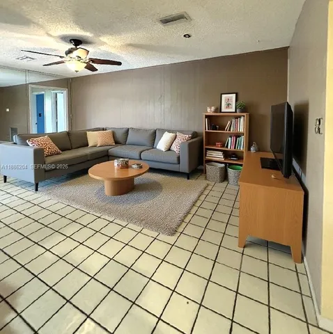 a view of a patio with table and chairs