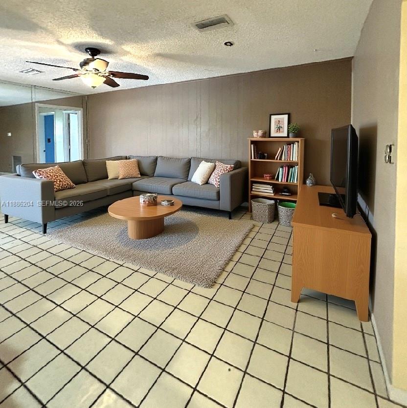6520 Southwest 20th Street Plantation, FL 33317 - Photo 21 of 43 a living room with furniture and a flat screen tv