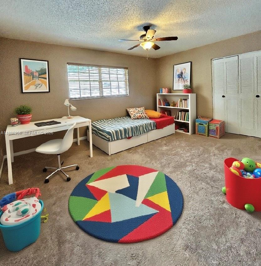 6520 Southwest 20th Street Plantation, FL 33317 - Photo 23 of 43 a living room with furniture and a baby crib