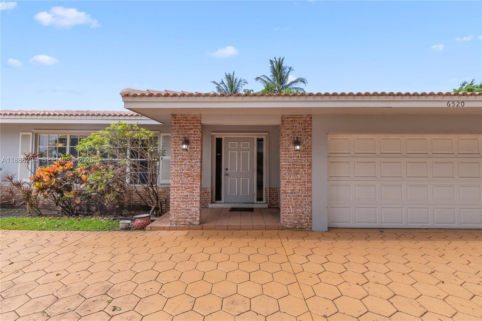 6520 Southwest 20th Street Plantation, FL 33317 - Photo 4 of 43 a view of a entrance gate of the house