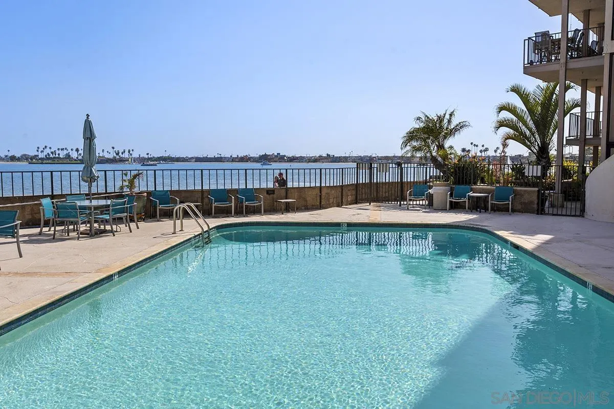 1125 Pacific Beach Drive, Unit 104 San Diego, CA 92109 - Photo 33 of 67 a view of a swimming pool with a lake view