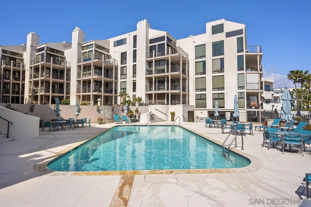 1125 Pacific Beach Drive, Unit 104 San Diego, CA 92109 - Photo 34 of 67 a view of a swimming pool with outdoor seating