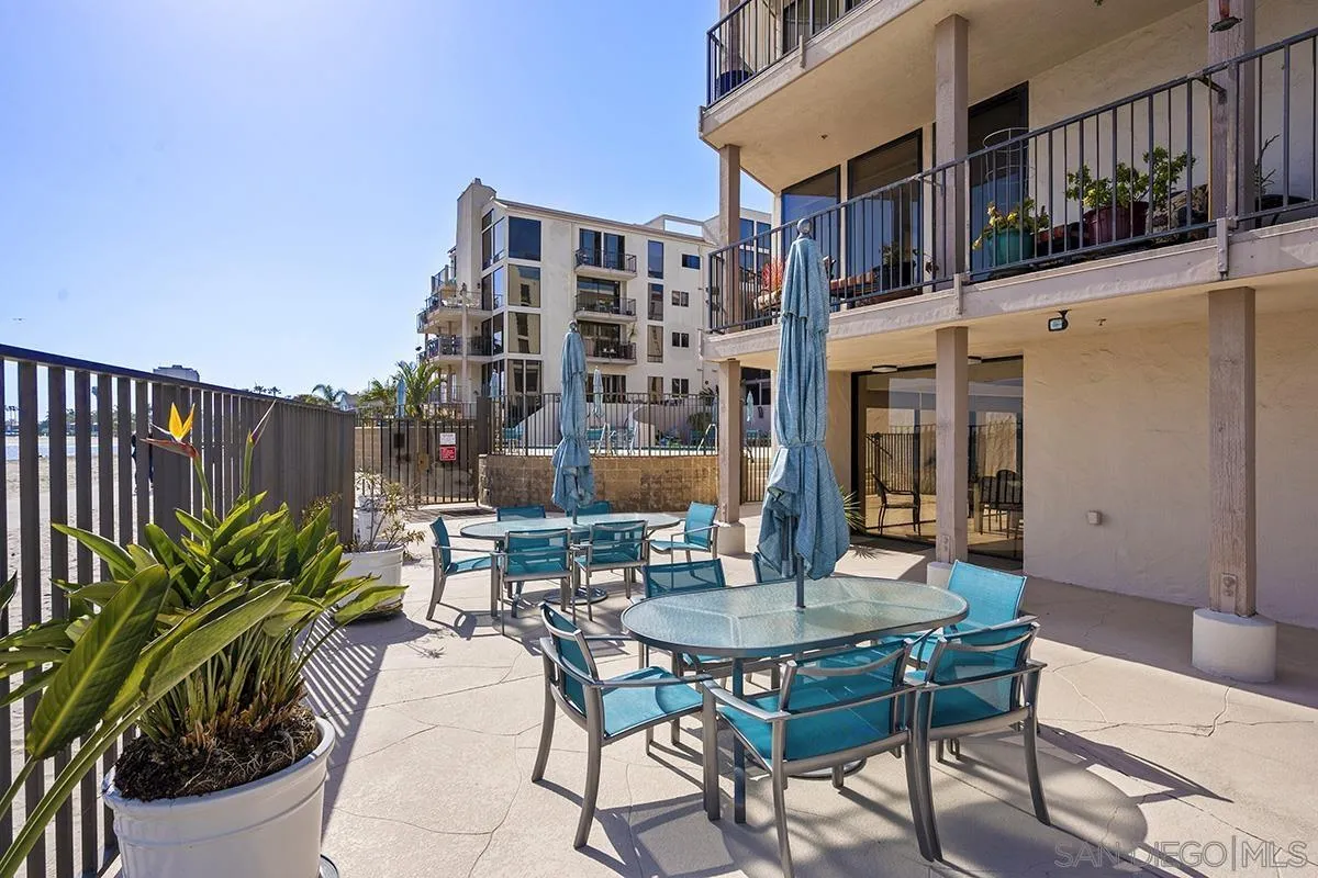 1125 Pacific Beach Drive, Unit 104 San Diego, CA 92109 - Photo 40 of 67 a view of a patio with a table and chairs