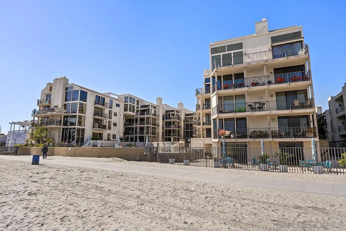 1125 Pacific Beach Drive, Unit 104 San Diego, CA 92109 - Photo 44 of 67 a front view of a building with streets and trees