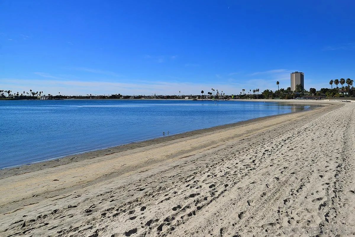 1125 Pacific Beach Drive, Unit 104 San Diego, CA 92109 - Photo 52 of 67 a view of an ocean beach and city