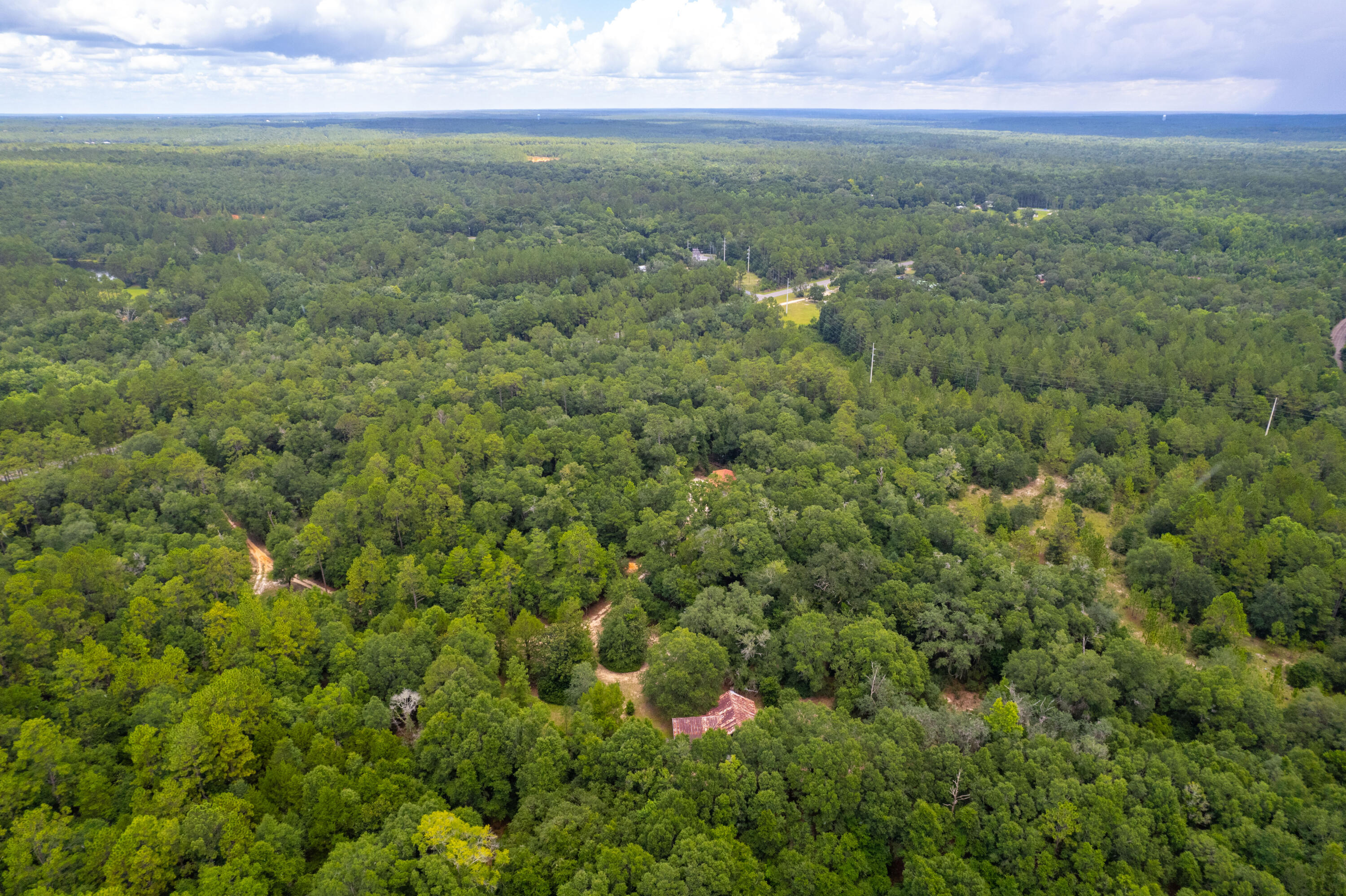 90 West Baker Baker, FL 32531 - Photo 3 of 8 an aerial view of residential houses with outdoor space and trees