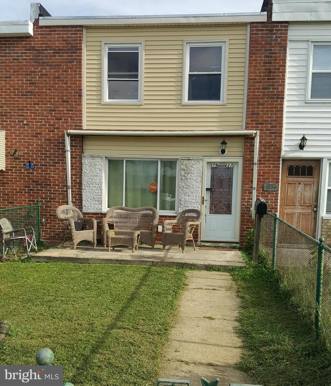 7937 Wynbrook Road Baltimore, MD 21224 - Photo 1 of 3 a view of house with backyard and sitting area