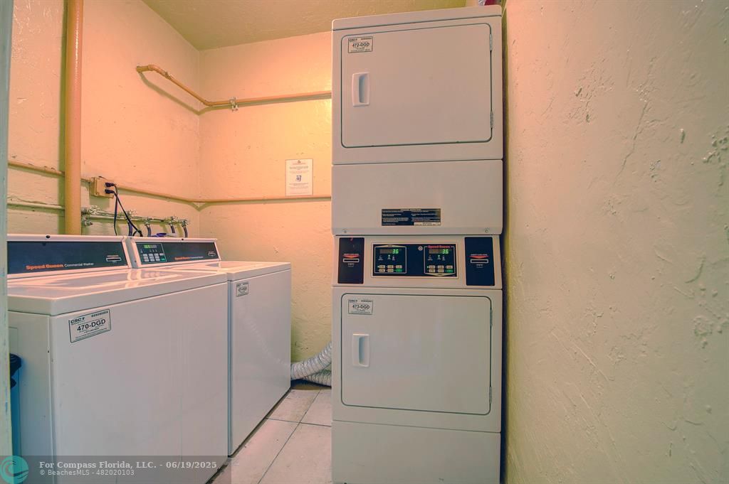18111 Northwest 68th Avenue, Unit I210 Hialeah, FL 33015 - Photo 15 of 23 a utility room with dryer and washer